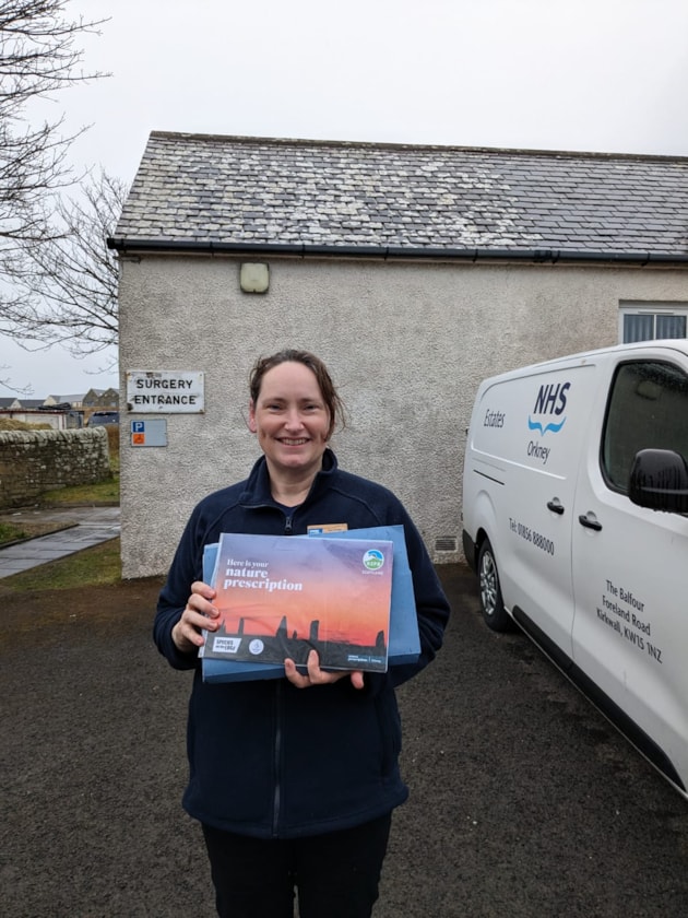 Sam Stringer with Nature Calendar, St Margarets Hope (c) Sarah Duly, NatureScot