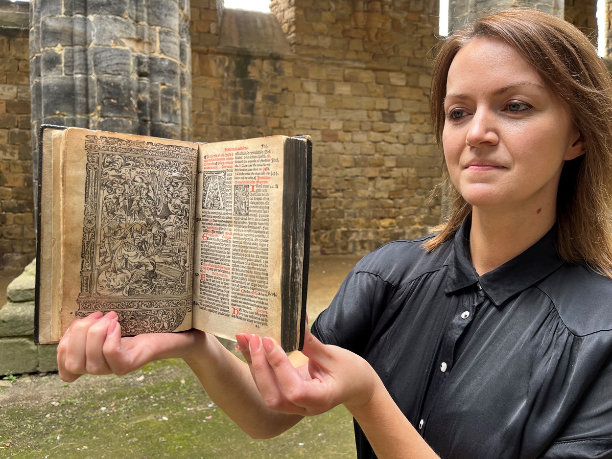 Kirkstall Missal: Senior librarian Rhian Isaac in Kirkstall Abbey with Leeds Central Library's precious copy of the Missale ad usum Cistercienci. Printed in Paris in 1516, the book is believed to have once belonged to the monks of Kirkstall Abbey and remarkably, it still contains notes and passages they delicately wrote by hand.