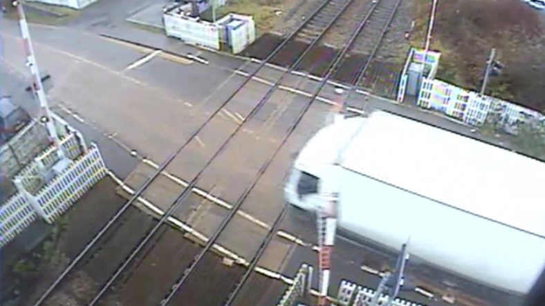 Safety warning after CCTV films lorry smashing through level crossing: Still from CCTV footage of the level crossing incident in Hartlebury