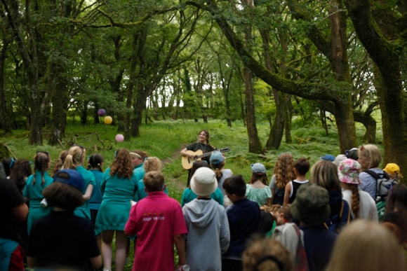 Mari Mathias performing in the woods