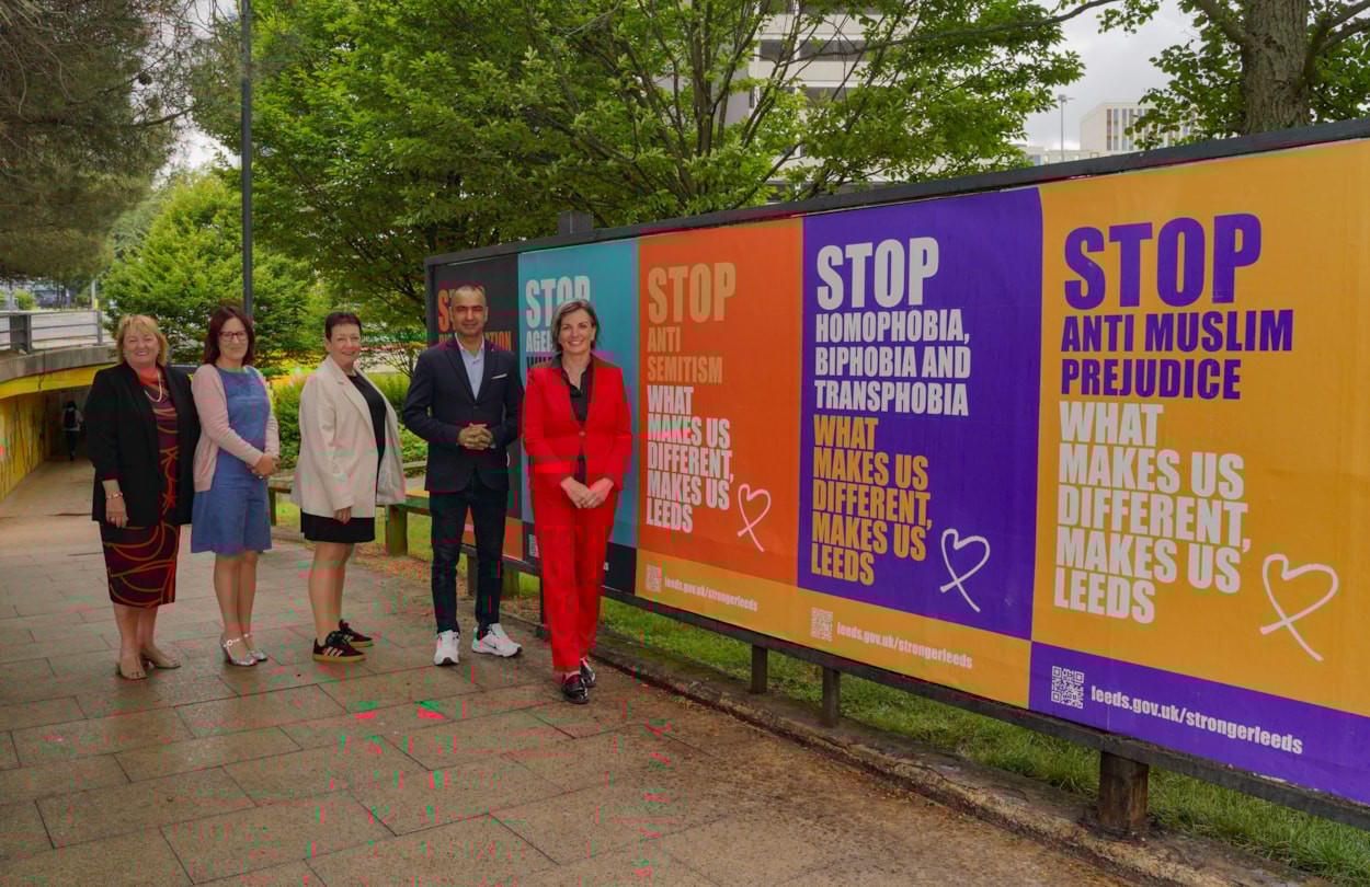 Executive members 1: Councillors Debra Coupar, Fiona Venner, Mary Harland, Mohammed Rafique and Helen Hayden with anti-discrimination campaign posters. The Leeds City Council campaign has communicated non-tolerance for misogyny, racism, anti-Muslim prejudice, antisemitism, ageism, homophobia, biphobia and transphobia, and disability discrimination.