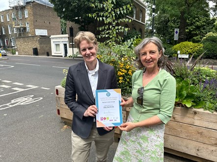 Cllr Champion and Alice Roberts, Chair of the Healthy Streets Scorecard, hold a certificate confirming the borough's success in the London-wide ranking