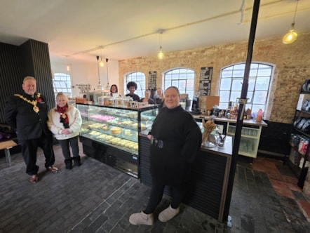 The mayor of dudley with business owner Zoe Konopka and team at the red house cone coffee shop