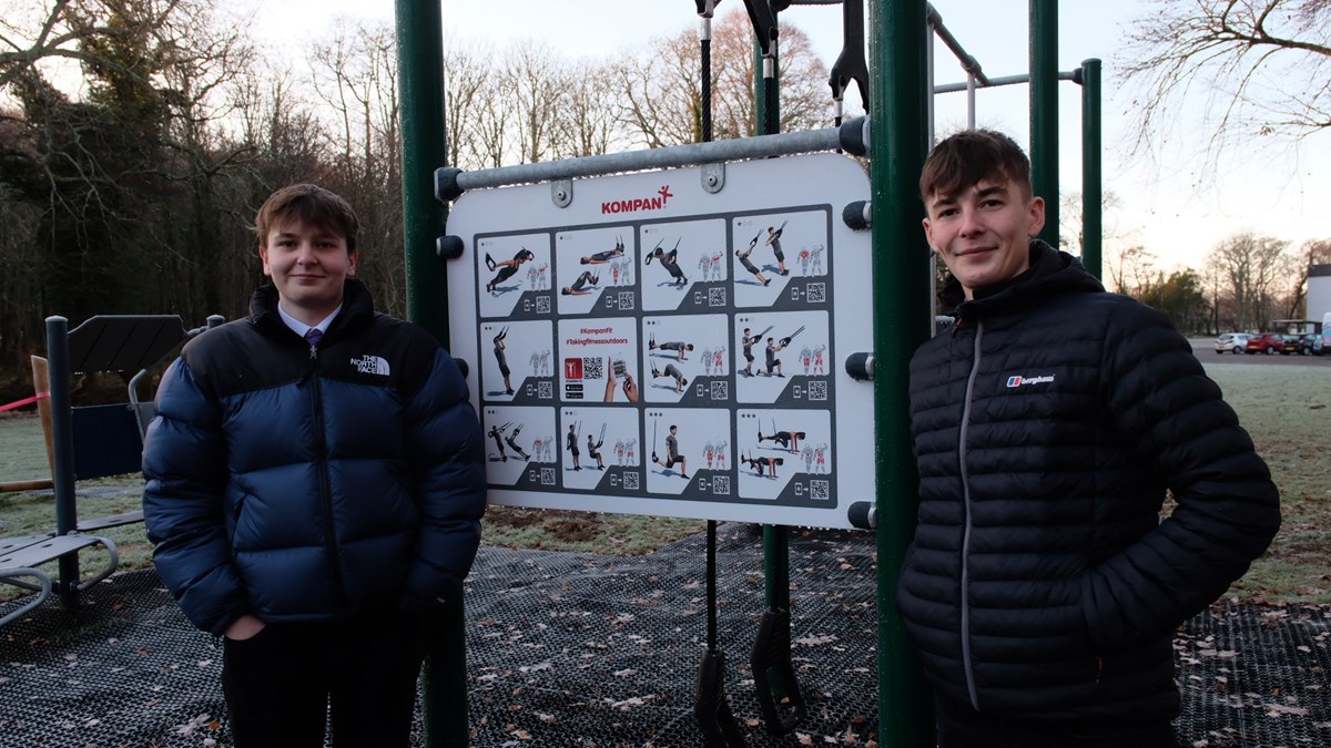 Forres Academy pupils Josh Angell and Lewis Mackenzie stand at the instruction board at the Forres Outdoor Gym.