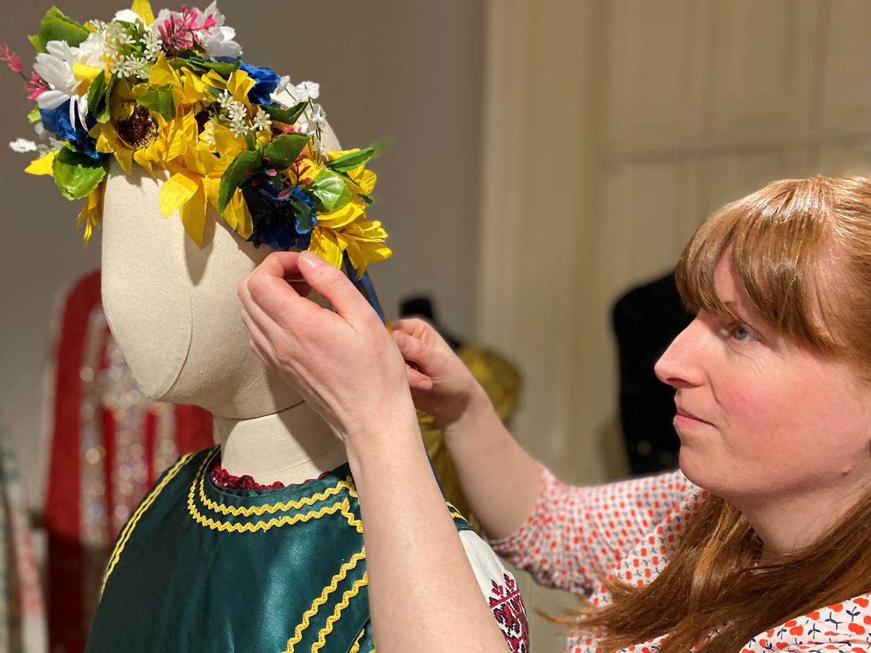 Ukrainian dress loan: Curator Natalie Raw works on the Ukrainian dress in the fashion gallery at Lotherton. From the central region of Ukraine, the costume consists of an embroidered shirt called a Vyshyvanka, which is worn along with a Vynok headdress and a sleeveless jacket called a Korstka.