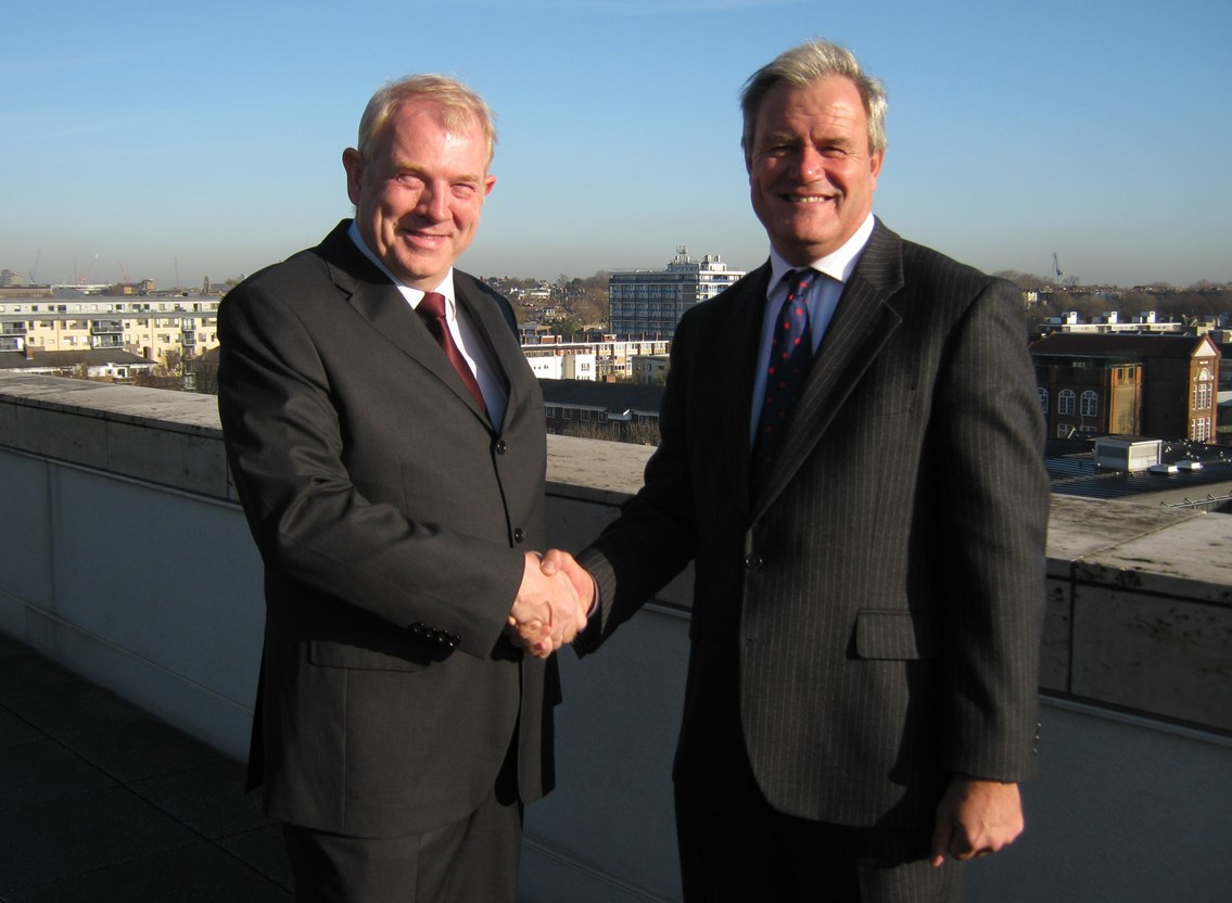 Manfred Schmitz, Windhoff Bahn- und Anlagentechnik GmbH's managing director (technical), and Robbie Burns, Network Rail's major programme director, seal the deal for the new electrification train