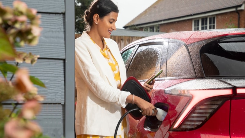 Motability Scheme customer charging an EV: Motability Scheme customer charging an EV