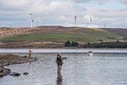 Llyn Brenig lake - angler in lake