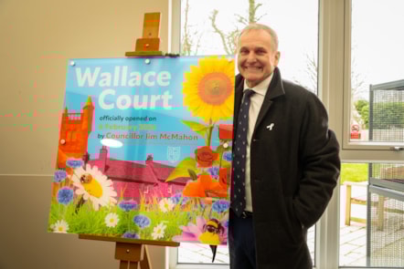 Cllr McMahon unveils the plaque to open Wallace Court