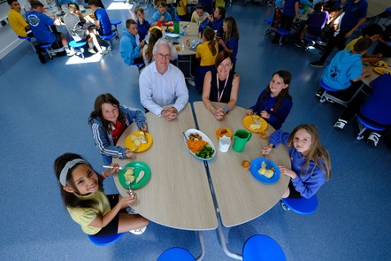 Children and staff at new dinner tables