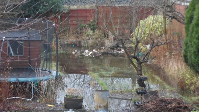 A flooded garden on Stamford Road in Audenshaw