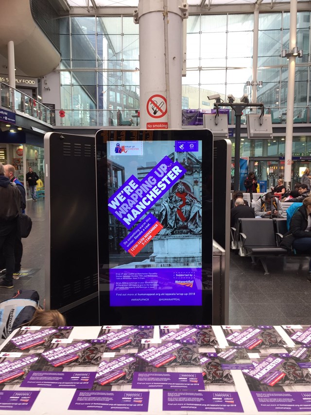Wrap Up Manchester display screens in Manchester Piccadilly station