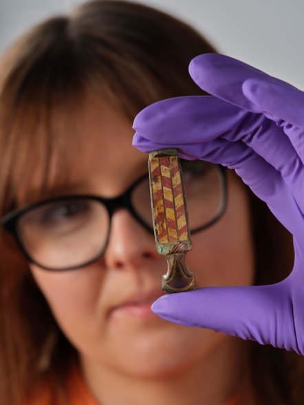 Assistant Curator Bethany Simpson with the Pathhead brooch. Image © National Museums Scotland 3