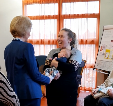 Dame Andrea meets Laura and baby Casper, and tickled his toes