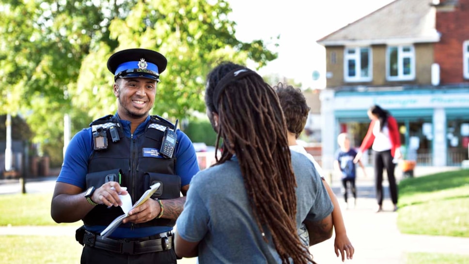 A police officer talking to a member of the public-2