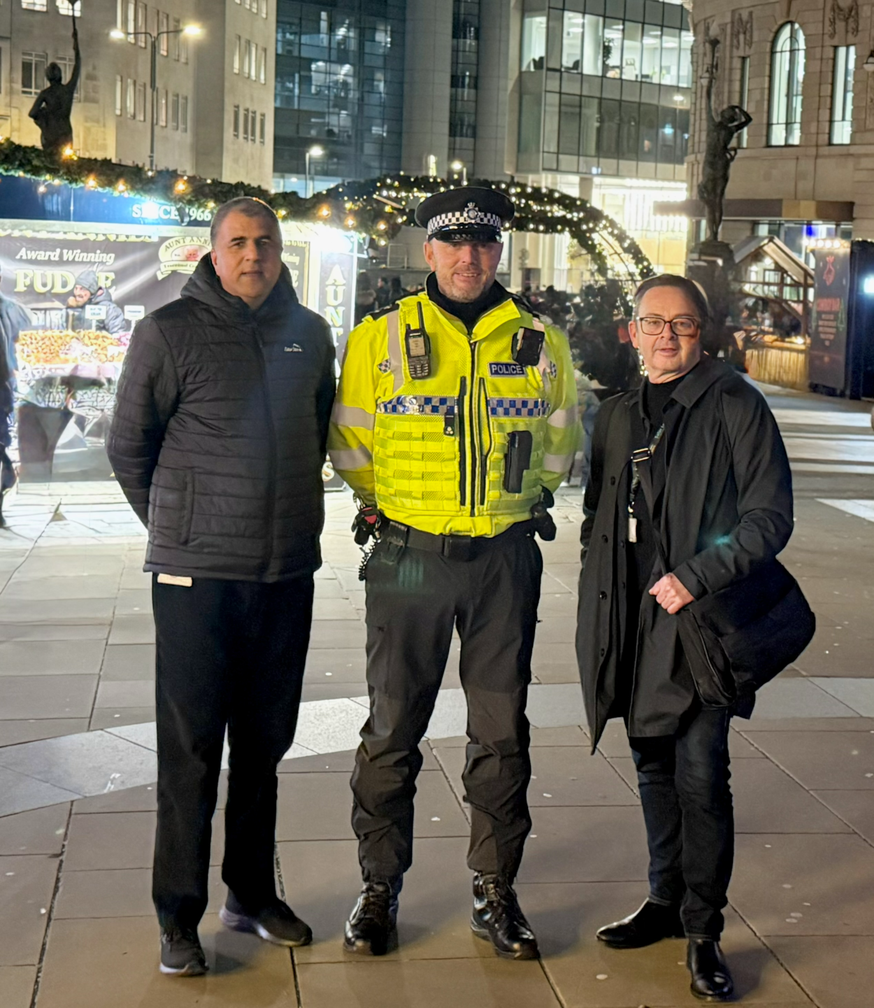 Night Safe Leeds 2025: Councillor Asghar Khan with a police officer from West Yorkshire Police and Simon Hodgson, Leeds City Council's head of community safety.