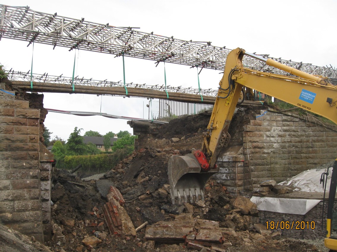 Carlisle Road bridge demolition - Airdrie: Bridge deck carrying A73 (Carlisle Road), Airdrie, demolished to make way for new bridge deck with adequate width and height clearance.