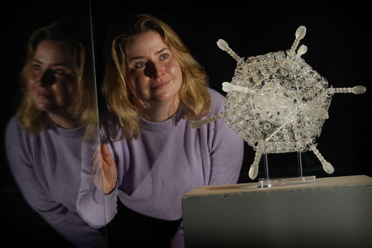 Curator Sophie Goggins with a sculpture of the Oxford-AstraZeneca Covid-19 vaccine in glass by Luke Jerram. The artwork is on display in Injecting Hope, a new exhibition at the National Museum of Scotland today.

Photo ©  Stewart Attwood