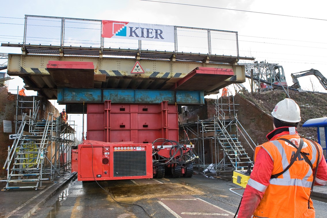 Easy does it!: The new bridge deck at Diss is inched into place on the back of an abnormal load-carrying vehicle. The bridge was successfully replaced during the Christmas weekend, with teams working around the clock to limit disruption to road and rail users.