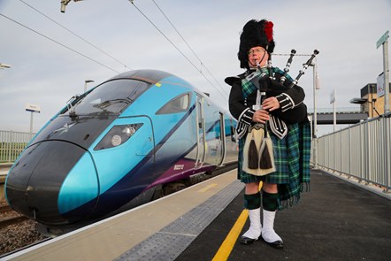 Sandy Mutch, the Border Piper, welcomes in the 6.16am TransPennine Express service to Reston Station, the first passenger service to stop in the village for more than 50 years.