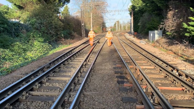 A track patrol at the junction being refurbished. The branch to the left takes trains to and from Enfield Town, while the lines to the right take trains to and from Cheshunt.