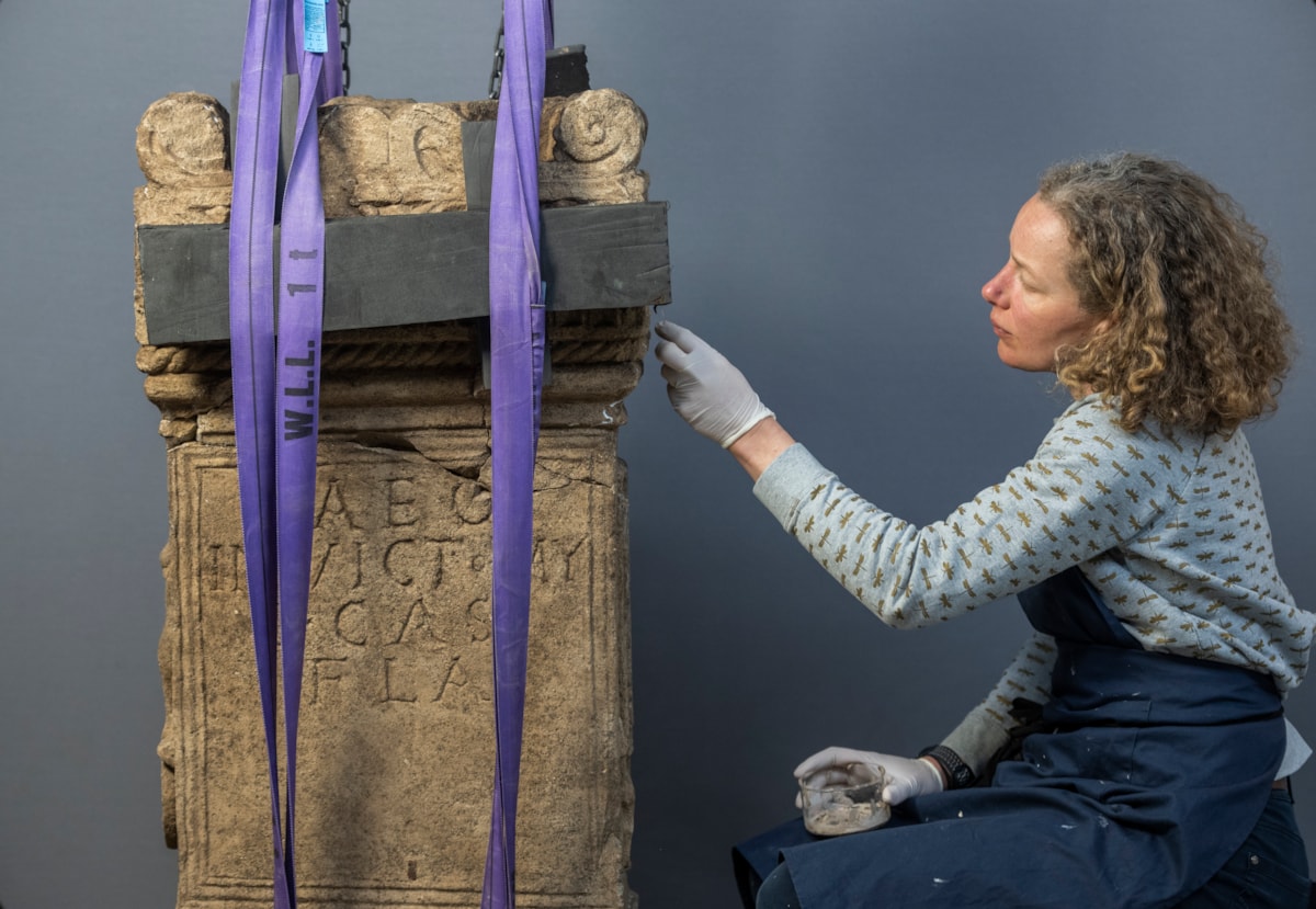 Conservator Diana de Bellaigue works on the Roman altar. Photo © Phil Wilkinson (3)