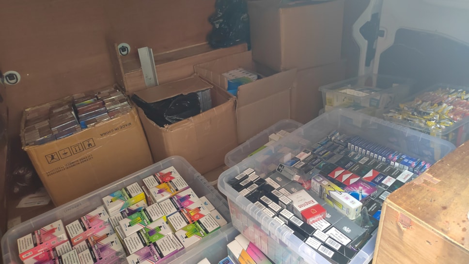 illegal tobbaco and vapes stored in a white business van