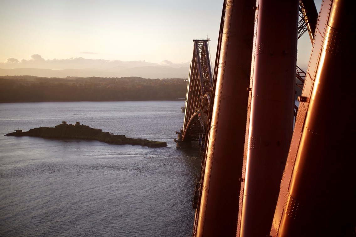 Forth Bridge, looking south.: Pic018: Paint is applied in three layers - a primer, a glass-flake epoxy and a top-coat. It’s the top-coat which gives the bridge its colour and its lustre, made to match the red-oxide paint first applied over 121 years ago. The RSPB protected island of Inchgarvie is visible in the background.