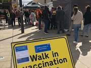 Pop up vaccination centre Exeter3: A queue of people waiting at the council's testing and vaccination mobile unit, in Exeter.