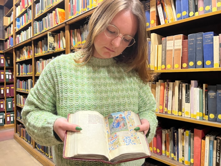 The Book of Hours: Library and digital assistant Alex Brummitt with The Book of Hours at Leeds Central Library.
Penned in around 1480 and inscribed on delicate vellum, the Horae beatae Mariae Virginis, or Book of Hours, contains forty-six vividly illuminated images depicting various duties to be carried out each month along with the signs of the zodiac.