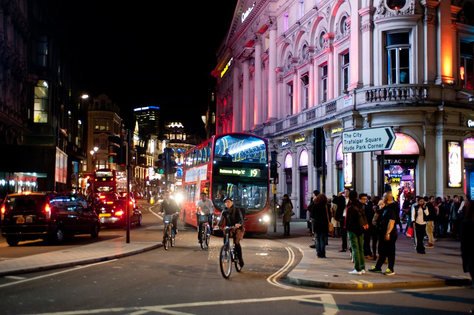 Bus and cyclists at night