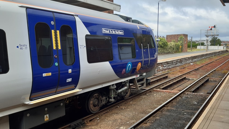 Images shows Northern train with Proud to be Northern banner