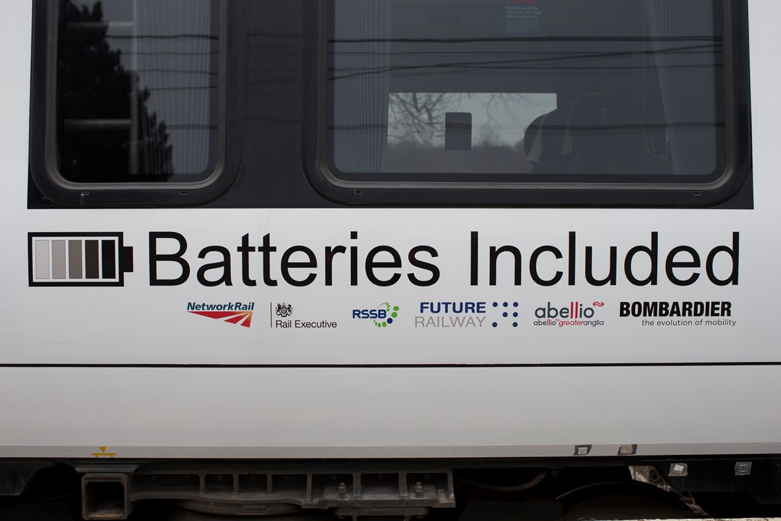 Logos on battery-powered train (IPEMU): The new train contributes to Network Rail’s commitment to reduce its environmental impact, improve sustainability and reduce the cost of running the railway by 20 per cent over the next five years. It could ultimately lead to a fleet of battery-powered trains running on Britain’s rail network which are quieter and more efficient than diesel-powered trains, making them better for passengers and the environment. Network Rail and its industry partners – including Bombardier, Abellio Greater Anglia, FutureRailway and the Rail Executive arm of the Department for Transport (which is co-funding the project) – recognise the potential for battery-powered trains to bridge gaps between electrified parts of the network and to run on branch lines where it would be too expensive to install overhead electrification.