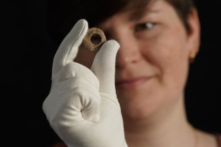 Janel Fontaine, Treasure Trove Officer, with the Medieval spindle whorl. Photo (c) Stewart Attwood. (4)