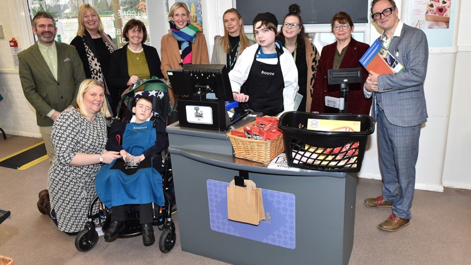 Leader of Lancashire County Council, Phillippa Williamson (3rd from left at the back) and County Councillor Jayne Rear (2nd from right at the back) pictured with Bleasdale School headteacher Sefton Booth (right), staff from the Lancashire Careers Hub and Booths supermarket, and pupils Jack (second left at the front) and Sebastian (front right).