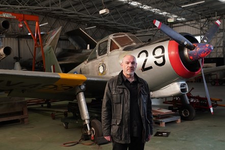 National Museum of Flight curator, Ian Brown beside a Percival Provost aircraft