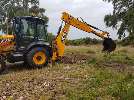 An illegal development next to a nature reserve was taken down by council enforcement staff yesterday