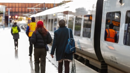 Image shows commuters alongside Northern train cropped