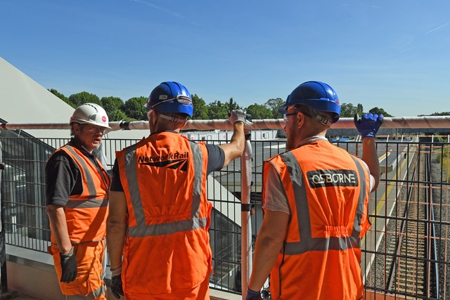 Engineers briefing on viewing deck over railway - Twickenham station