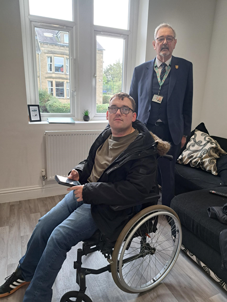 Resident Joshua Edwards with Lancashire County Councillor Graham Gooch, cabinet member for Adult Social Care.
