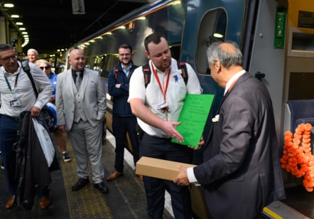 Colleagues past and present welcomed Girish at London Euston after he drove the last train of his working life.