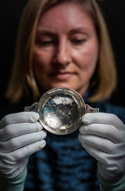 Lyndsay McGill, Curator of Renaissance and Early Modern History at National Museums Scotland holds the 17th century silver quaich. Photo © Phil Wilkinson