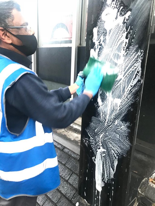Graffiti being cleaned at Euston station