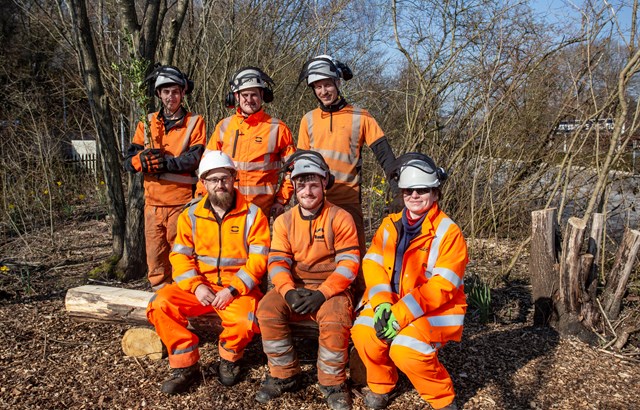 Tree Sustainability-5: Network Rail ecologist Sophie Mairesse and a team from Coombes working to create a public space with freshly-planted oak trees and holly, at Robertsbridge