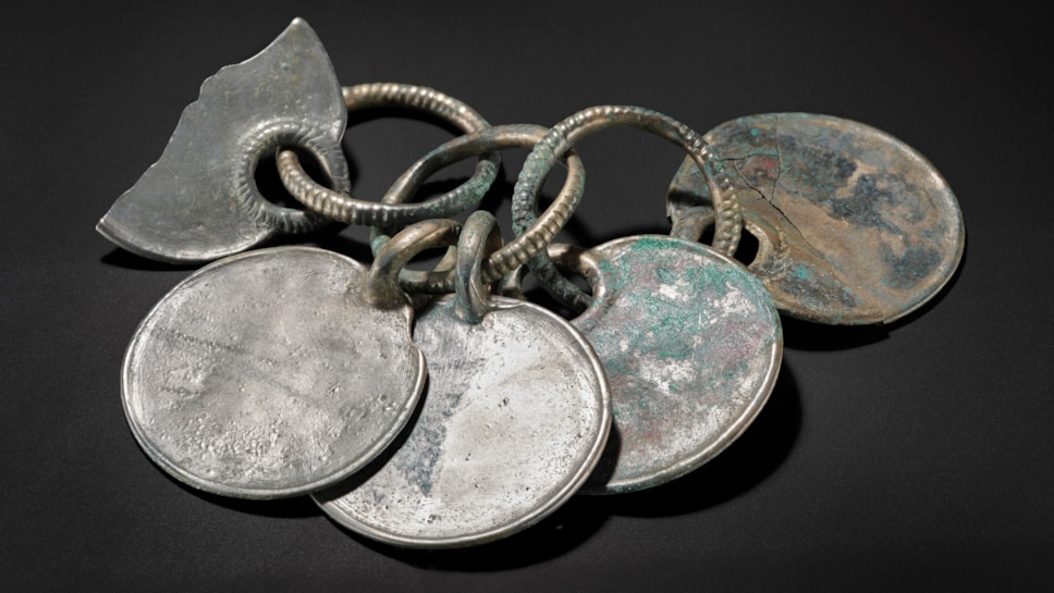 Bronze rattle pendant from the Peebles Hoard. Image © National Museums Scotland