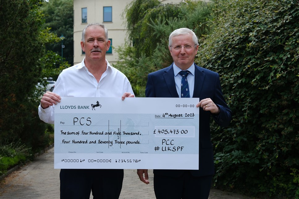 Michael Hooper from Pembrokeshire Care Society with Cabinet Member for Finance Cllr Alec Cormack and grant cheque for UK SPF