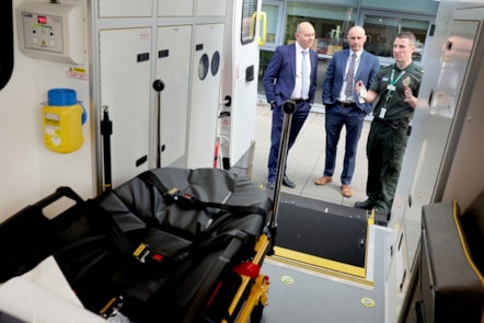 Operations manager Darren Green and Chief Executive Kev Scollay show Sir Jim Mackey around a new vehicle
