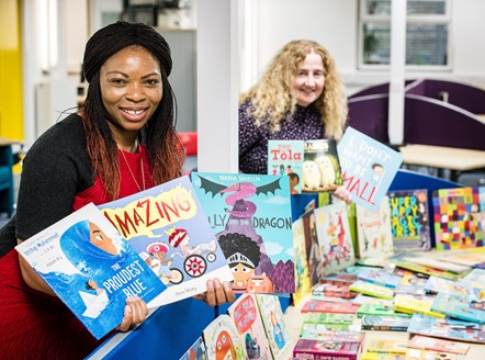 Cllrs Ngongo and O'Halloran with books to be donated to Mother Tongue Supplementary Schools