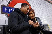 TfL Image - Passengers using mobile on Holland Park platform