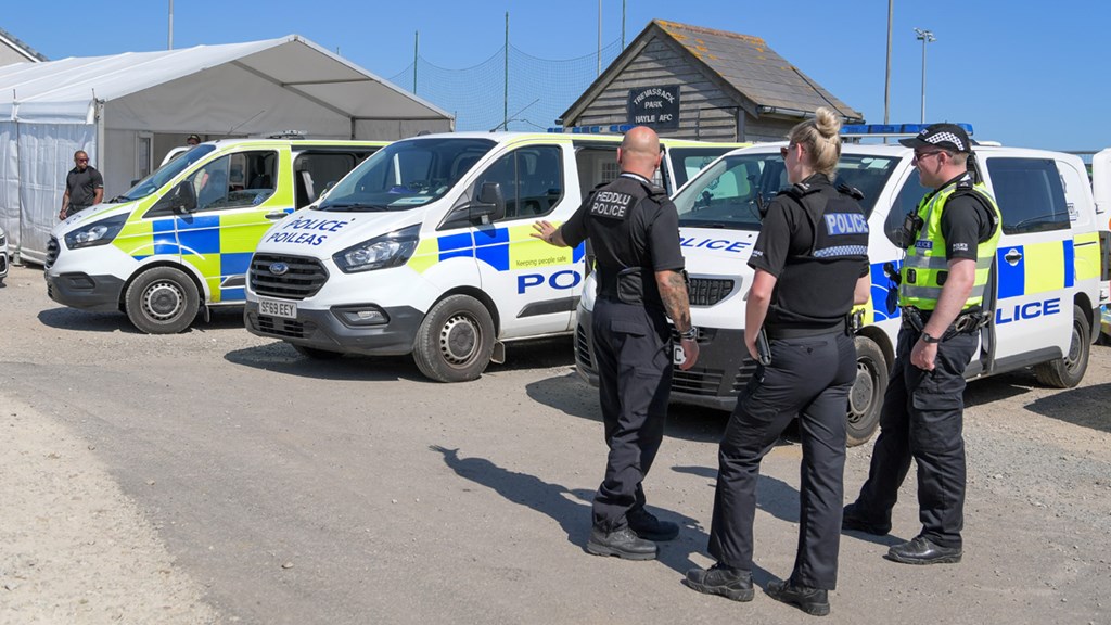 Officers next to police vans